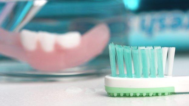 Tooth brush and partial denture