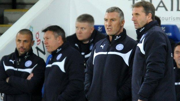 Nigel Pearson talks to his backroom staff against Liverpool