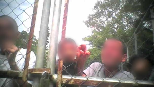 Patients behind wire fence