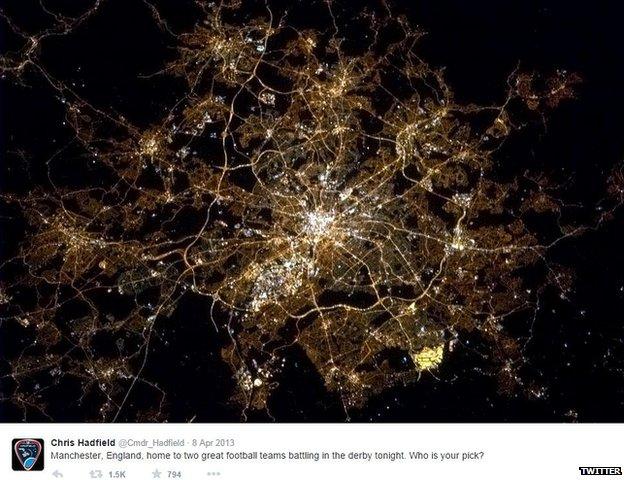 screengrab of Chris Hadfield's tweet and photo of Greater Manchester at night from space