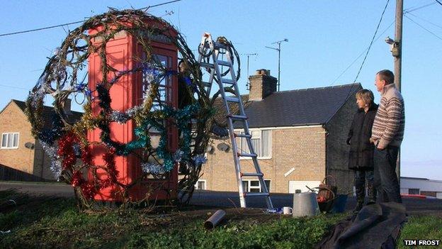 Prickwillow phone box being decorated