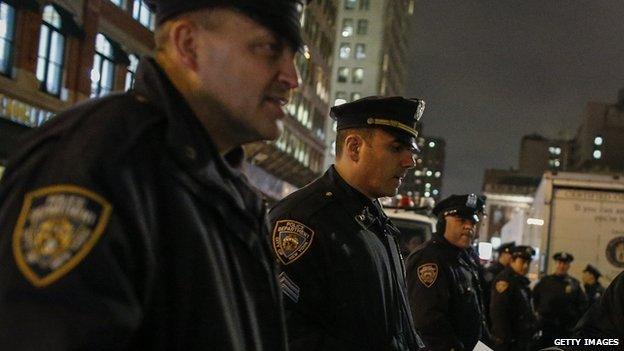 New York City police watch protestors following the announcement that Daniel Pantaleo will not be indicted.