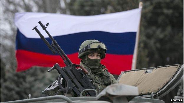 Russian flag behind a Russian army vehicle outside Balaclava, 1 March 2014