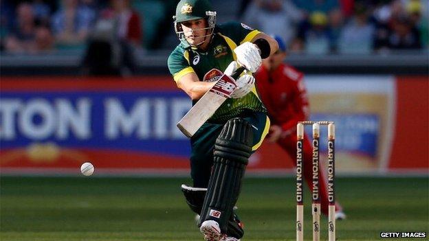 Aaron Finch of Australia plays a straight drive during game one of the one day international series between Australia and England at Melbourne Cricket Ground on January 12, 2014