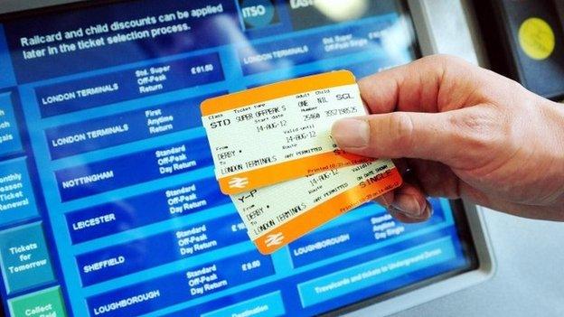 A passenger buying a train ticket