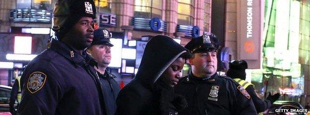 Police arrest a demonstrator at a protest over the death of Eric Garner in New York, 4 December