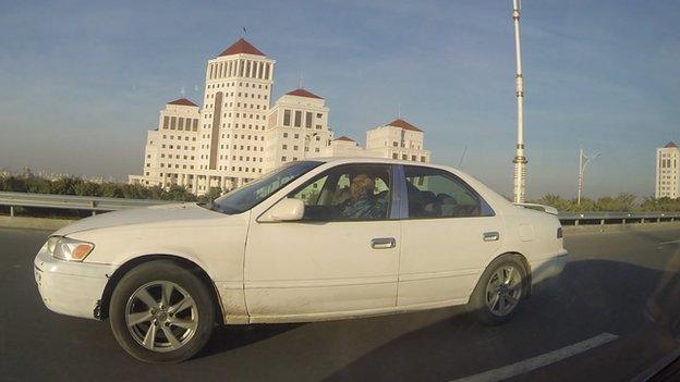 Policeman in Ashgabat driving while using his mobile (Nov 2014)