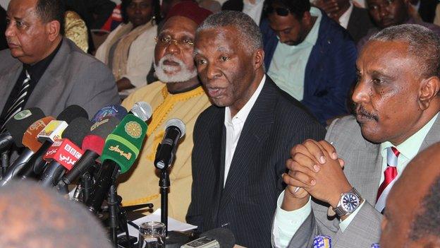 Thabo Mbeki (centre, in suit)