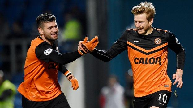 Nadir Ciftci congratulates Stuart Armstrong (right) as Dundee United beat Ross County.