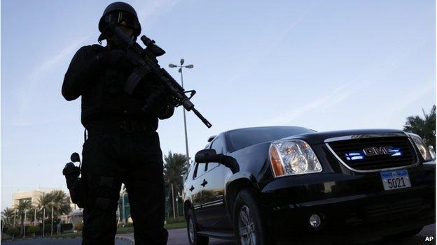 A police officer stands guard outside a security conference in Manama, Bahrain