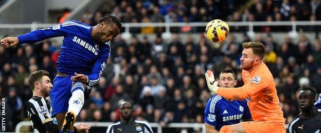 Chelsea striker Didier Drogba scores a header in his side's 2-1 defeat at Newcastle