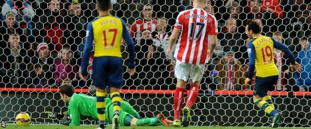 Arsenal's Santi Cazorla scores