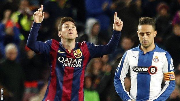 Lionel Messi celebrates scoring for Barcelona