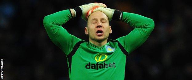 Aston Villa goalkeeper Brad Guzan reacts during his team's game with Leicester