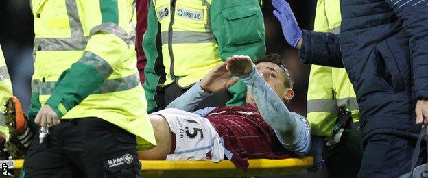 Aston Villa midfielder Ashley Westwood is carried off on a stretcher during his team's game with Leicester City