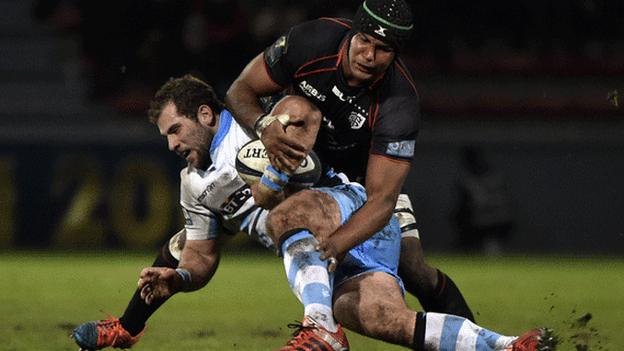 Toulouse flanker Thierry Dusautoir (top) vies with Glasgow Warriors hooker Fraser Brown