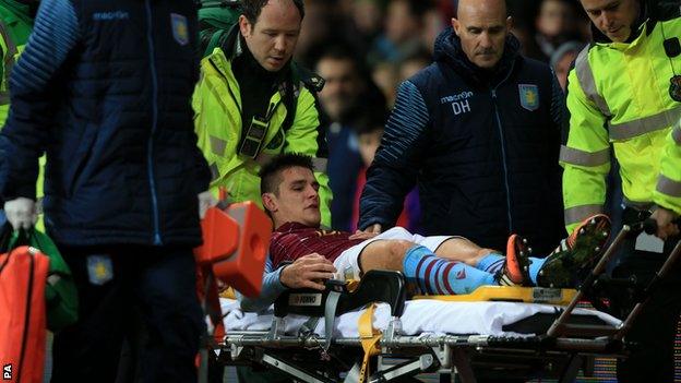 Ashley Westwood is stretchered off at Villa Park