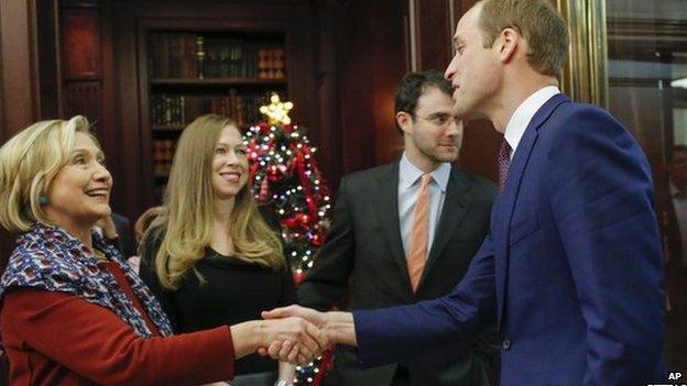 Hillary Clinton shakes hands with Prince William as Chelsea Clinton looks on at reception at the British Consul General's residence