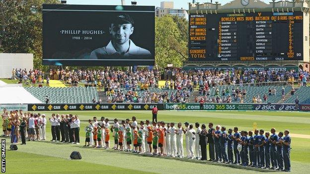 Players stand for 63 seconds of applause in memory of Phillip Hughes