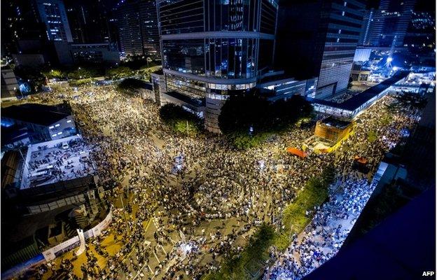 Protestors and student demonstrators gather during a demonstration outside headquarters of the Legislative Counsel on 28 September 2014 in Hong Kong.