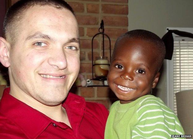 Joseph with Milo, one of the Briggs's adopted grandchildren