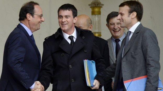 Francois Hollande (L), Manuel Valls (C), Emmanuel Macron (R)