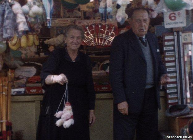 Stall holders show off a prize at the Peter fair in Banff. A still from footage recorded by Ian and Jack Johnstone in the 1960s