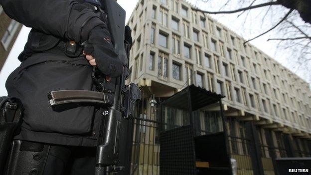 Armed police officer guards US embassy in London - 9 December