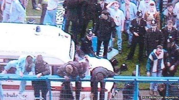 People climbing on the fences at Hillsborough