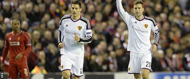 Basel celebrate scoring against Liverpool at Anfield in the Champions League