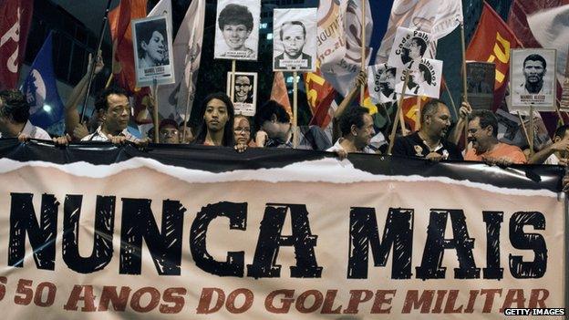 Activists of Amnesty International Brazil stage a demonstration on 1 April, 2014, marking the 50th anniversary of the coup that led to the 1964-1985 military dictatorship