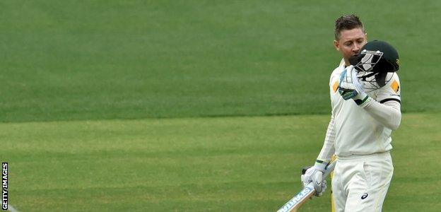 Clarke kisses his helmet after reaching his century