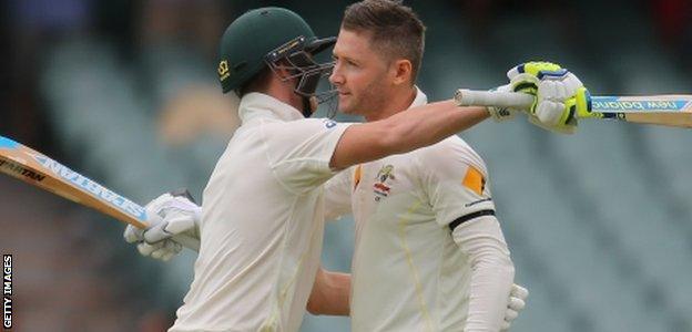 Clarke is embraced by Smith