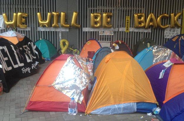 Sign saying 'We will be back' at Hong Kong protests