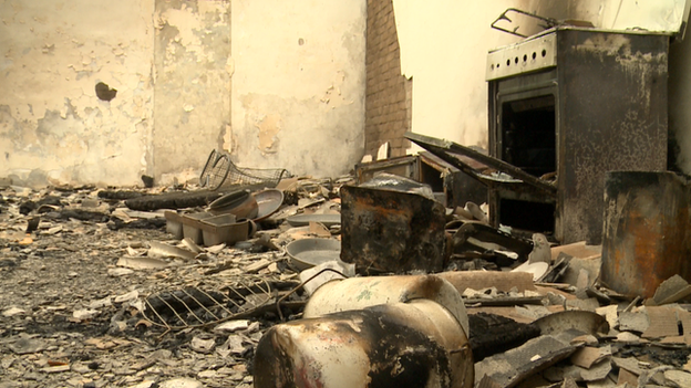 An oven sits burnt in the aftermath of an attack on a house in a Chechen village