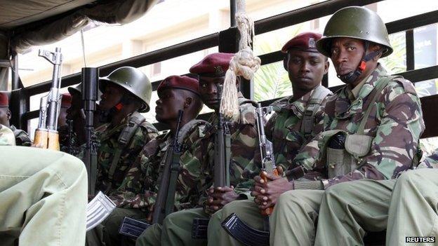 Kenyan policemen patrol in a truck outside the Westgate shopping mall during the first anniversary memorial service of the Westgate terrorist attack in Nairobi