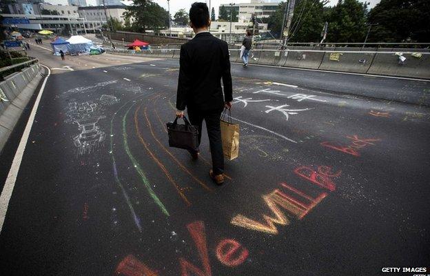 Man walks through empty streets in Hong Kong (11 Dec 2014)