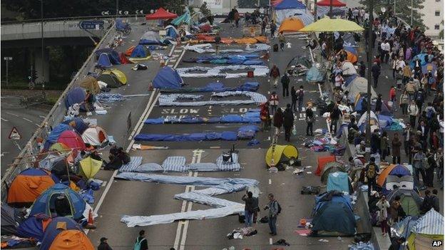 Beddings spells out 'We'll be back' on a road in Hong Kong (11 Dec 2014)