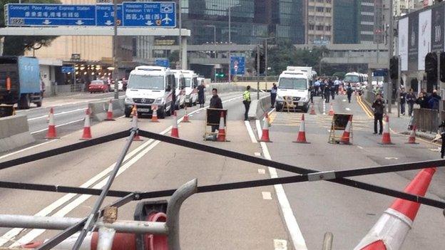 Police buses near barricades