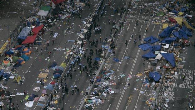 A general view of a main road after police clear barricades and tents outside government headquarters in Hong Kong on 11 December 2014.