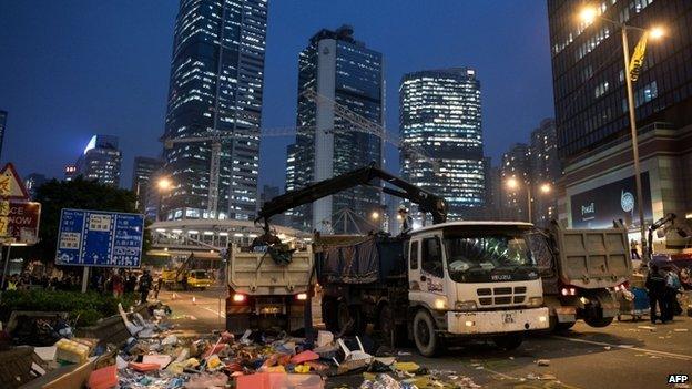 The debris of a pro-democracy protest camp is cleared away into trucks next to the central government offices in the Admiralty district in Hong Kong on 11 December 2014.