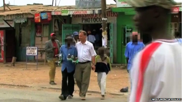 Still from a VAE promotional video show Harris walking alongside Gilgil street boys