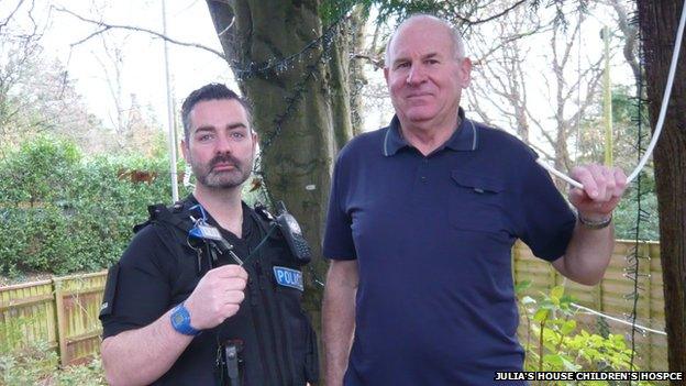 PC Garry Weston and Allan Ward, hospice maintenance officer, with the remaining wire