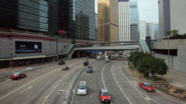 Traffic passes down a main thoroughfare of Hong Kong's Admiralty district on December 12, 2014