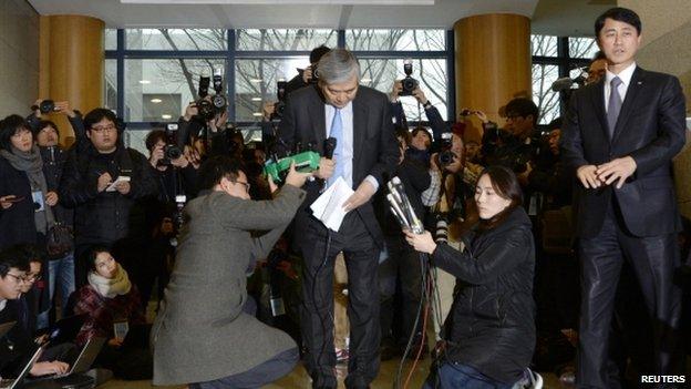 Cho Yang-ho, chairman of Korean Air Lines, bows as he speaks to the media at company's headquarter in Seoul 12 December 2014.