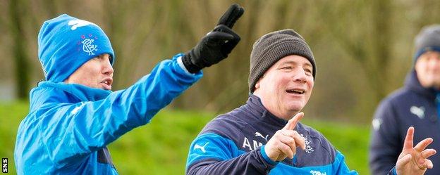 Kenny Miller and Ally McCoist joke during training on Thursday