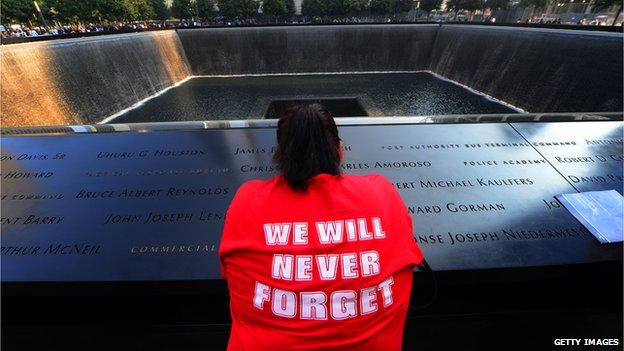 A woman is seen near the World Trade Center in New York on 11 September 2013