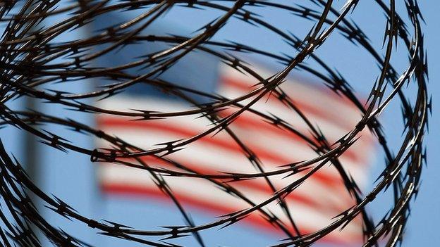 A roll of protective wire is seen near an American flag on 27 October 2009