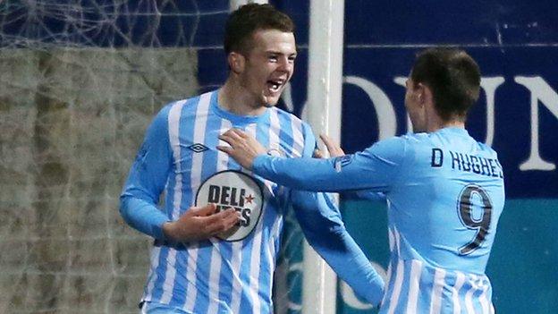 Ciaran O'Connor [left] scored two first-half goals for Warrenpoint against the leaders