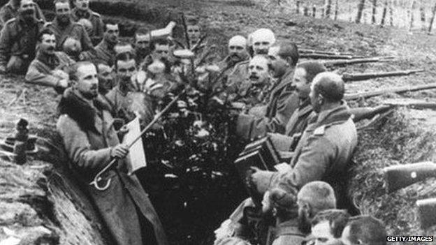 German soldiers cluster round a Christmas tree in 1914